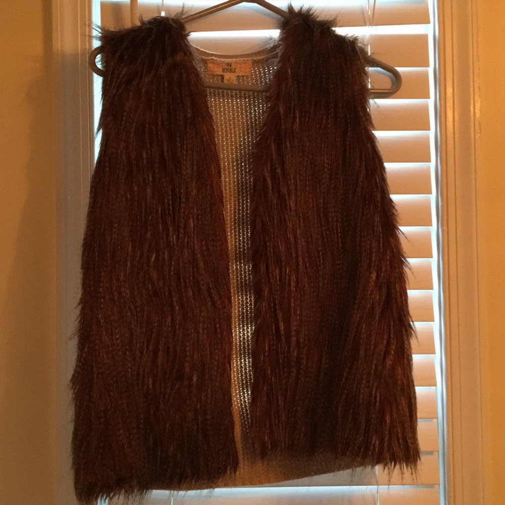 Cute light fall vest with a knitted back!